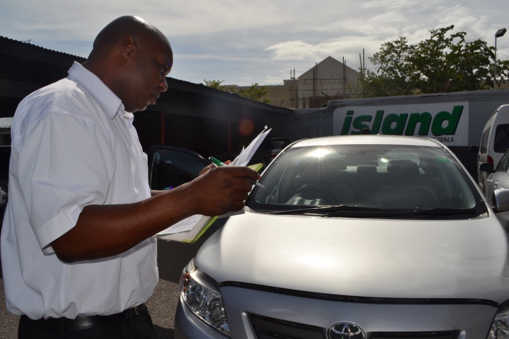 Getting the Corolla checked out at Island Car Rental